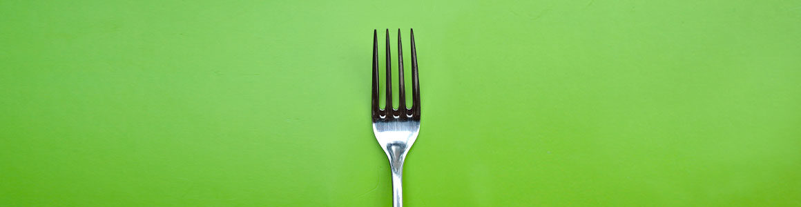 Fork on a green background.